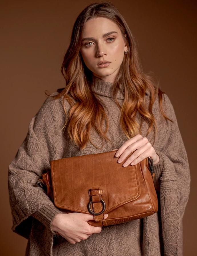 women holding italian leather handbag